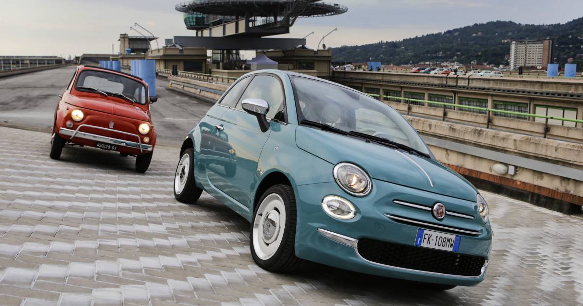 A red 1950s Fiat 500 and turquoise modern one on the Lingotto factory's rooftop test track