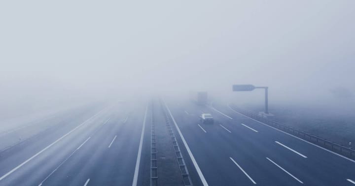 A motorway photographed in fog