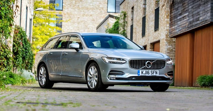 A silver Volvo V90 estate car parked in a mews